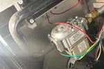 Norcross Atlanta Heating Furnace Repair 30071 by The Air Company of GA.  Close-up of a furnace blower motor and electrical wiring inside a heating unit for HVAC systems.
