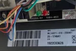 Commercial HVAC Repair in Atlanta Decatur 30317 by The Air Company of GA.  Electronic circuit board with multicolored wires and barcode label on attached component.