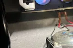 Norcross Atlanta Heating Furnace Repair 30071 by The Air Company of GA.  Close-up of furnace gas valve and igniter with visible blue flames inside heating unit