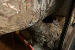 Furnace Heating Repair in Atlanta Decatur 30030 by The Air Company of GA.  Insulated flexible duct and metal furnace components with red and black electrical wires on concrete floor.