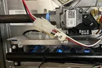 AC Repair in Roswell GA by The Air Company of GA. Close-up of complex furnace wiring and control components inside metal casing with various wires and circuit boards.