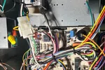 Residential HVAC AC Heating Repair Atlanta Brookhaven 30319 by The Air Company of GA.  Inside view of an HVAC system showing electronic control board with multicolored wiring connected to components and filter.