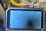 Atlanta HVAC Heat Furnace Repair 30338 Dunwoody by The Air Company of GA.  Inspection camera showing inside a metal pipe with surrounding gas lines and equipment.