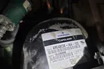 Close-up of Emerson Copeland refrigeration compressor model ARE48C5E-IAA-103 with identifying label and serial number.