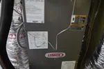 Residential HVAC Repair in Dunwoody 30338 by The Air Company of GA. Pressures are low on unit.  Lennox HVAC air handler unit installed with insulated ductwork and labeled service information.