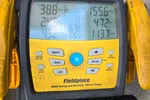 Wine Cellar Repair in Marietta 30064 by The Air Company of GA.  Fieldpiece SMAN refrigerant manifold gauge showing pressure and temperature readings for HVAC system.