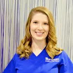 Smiling woman in blue scrubs with Burleson Pediatric Dentistry logo against striped background