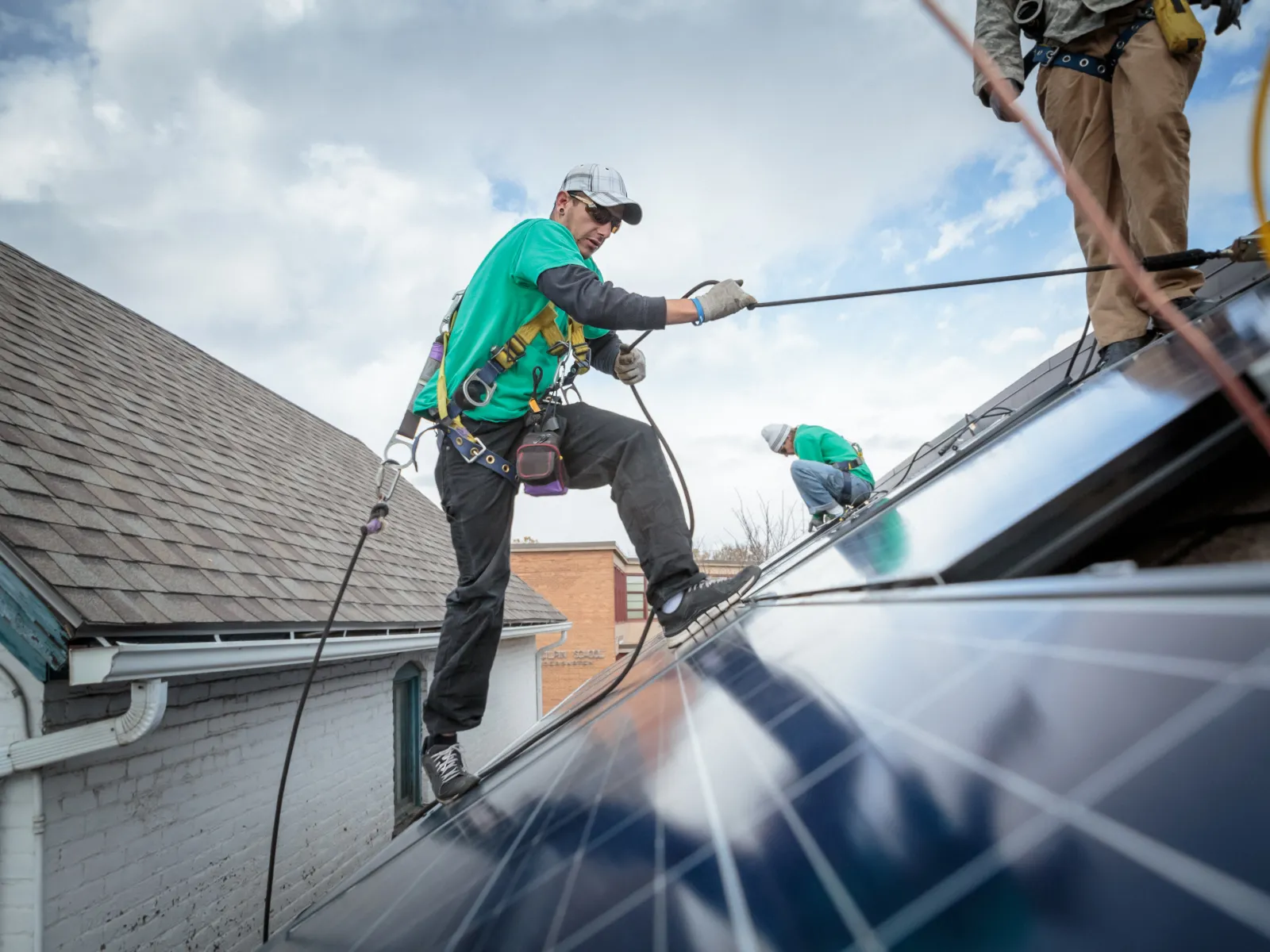 a group of people working on a roof