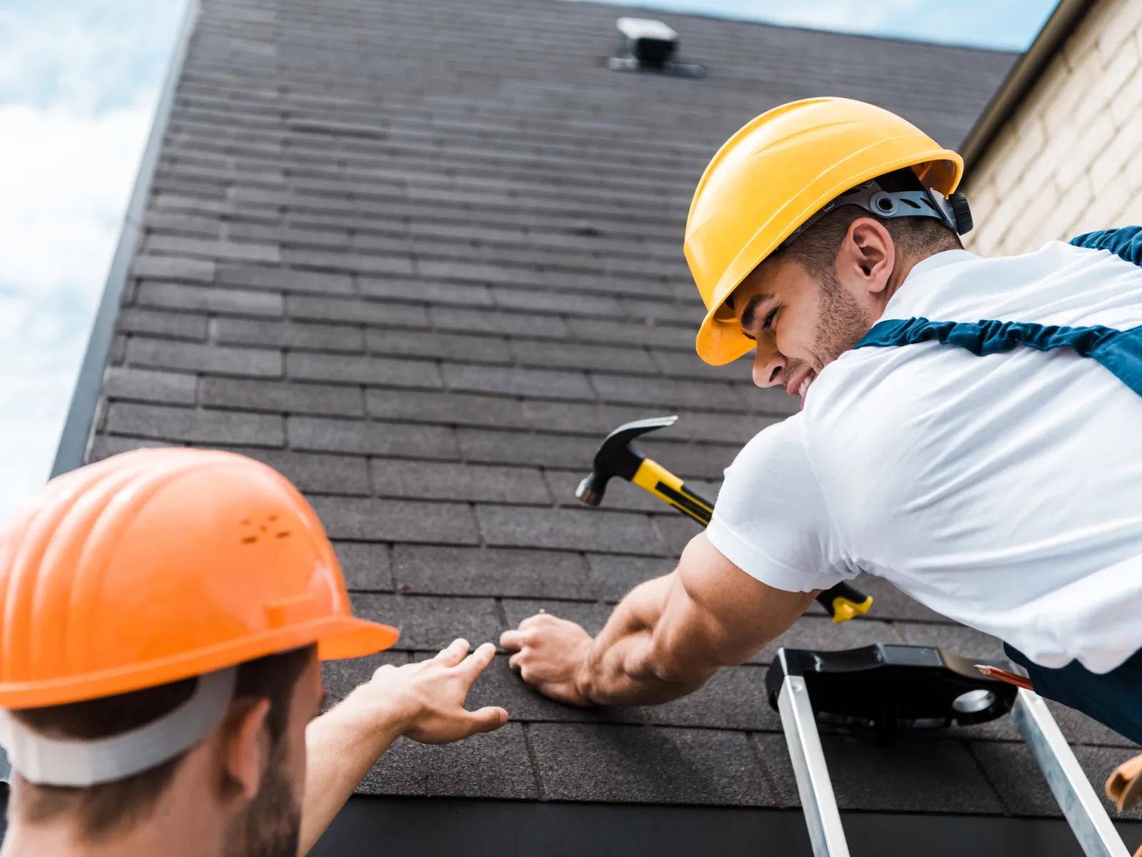 a few men wearing hard hats