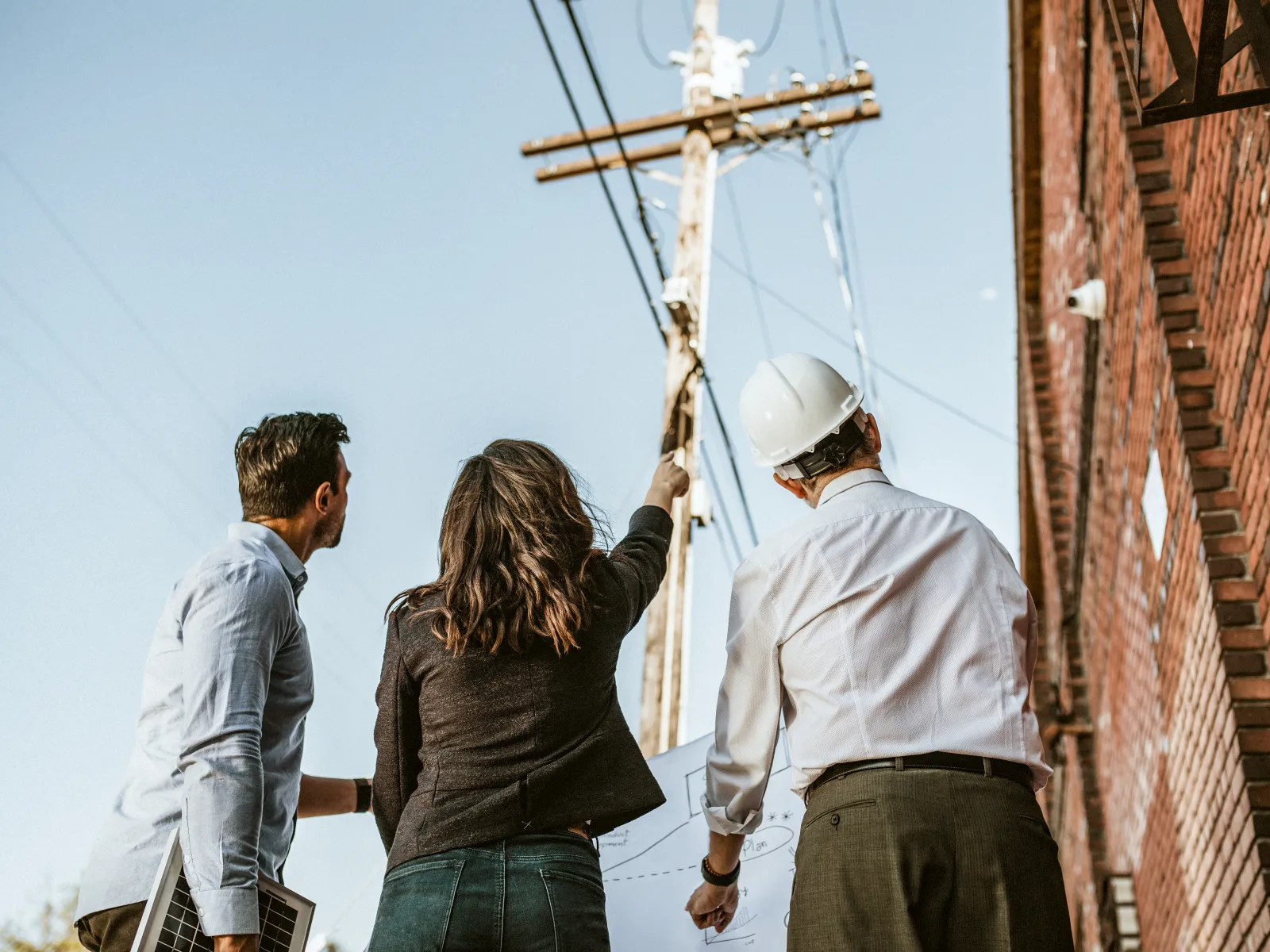 a few people working on a building