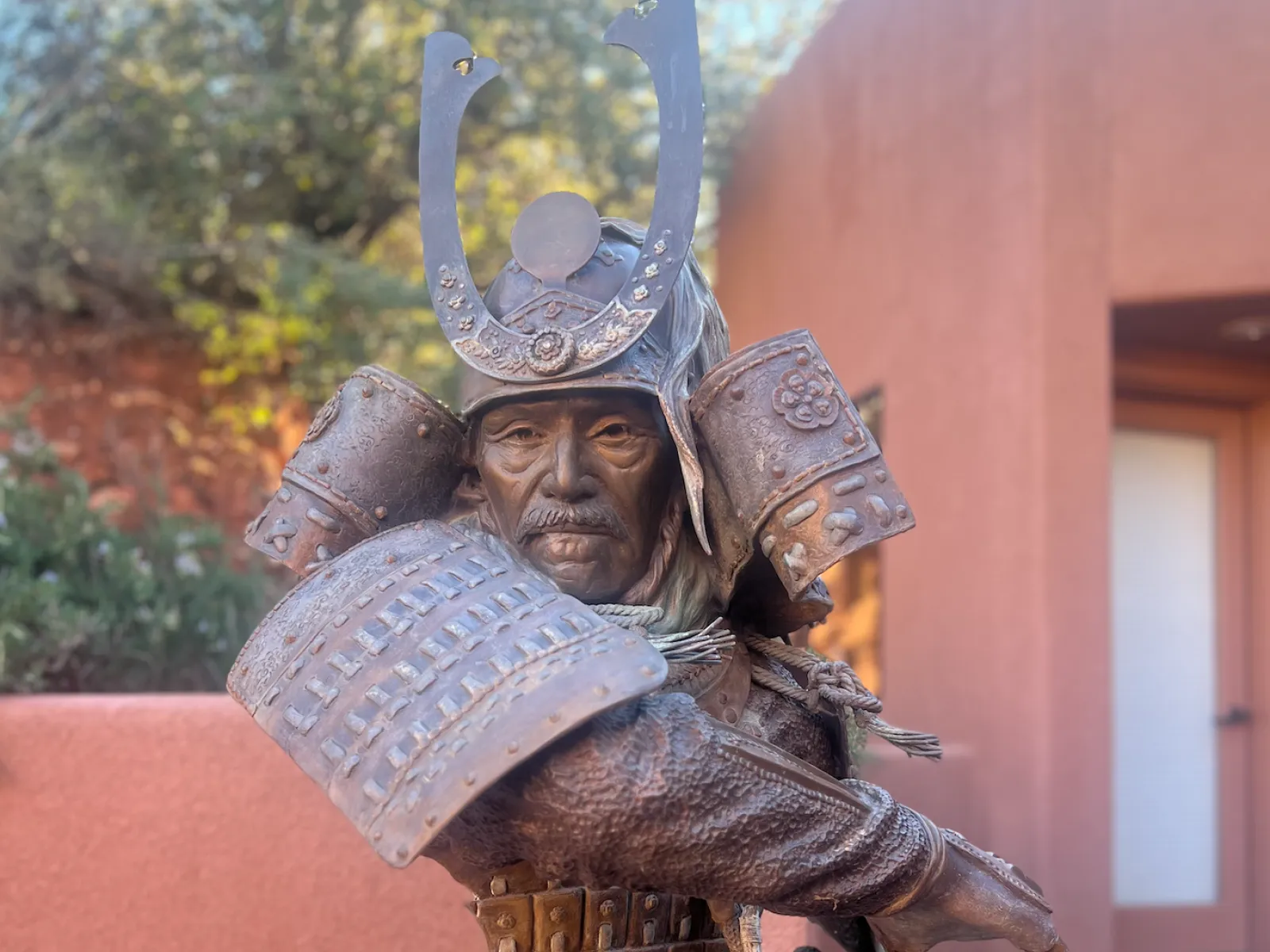 a statue of a person holding a sword