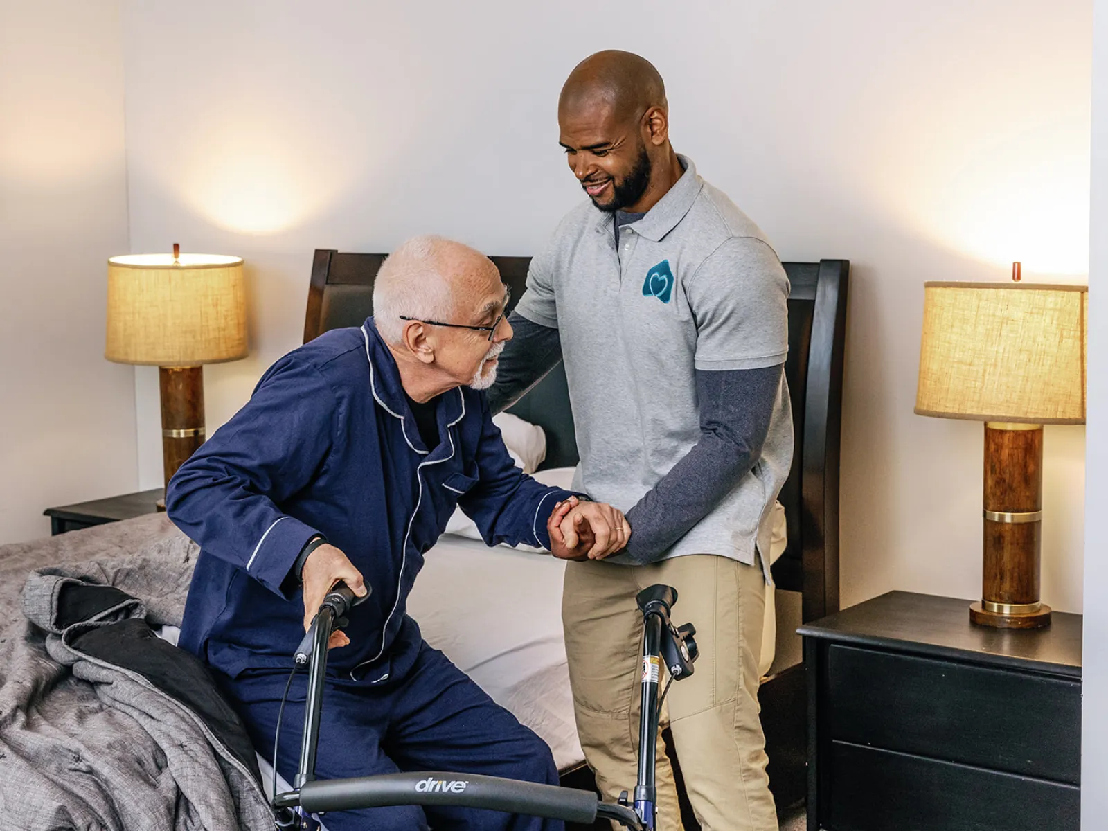 a man in a wheelchair being helped by another man