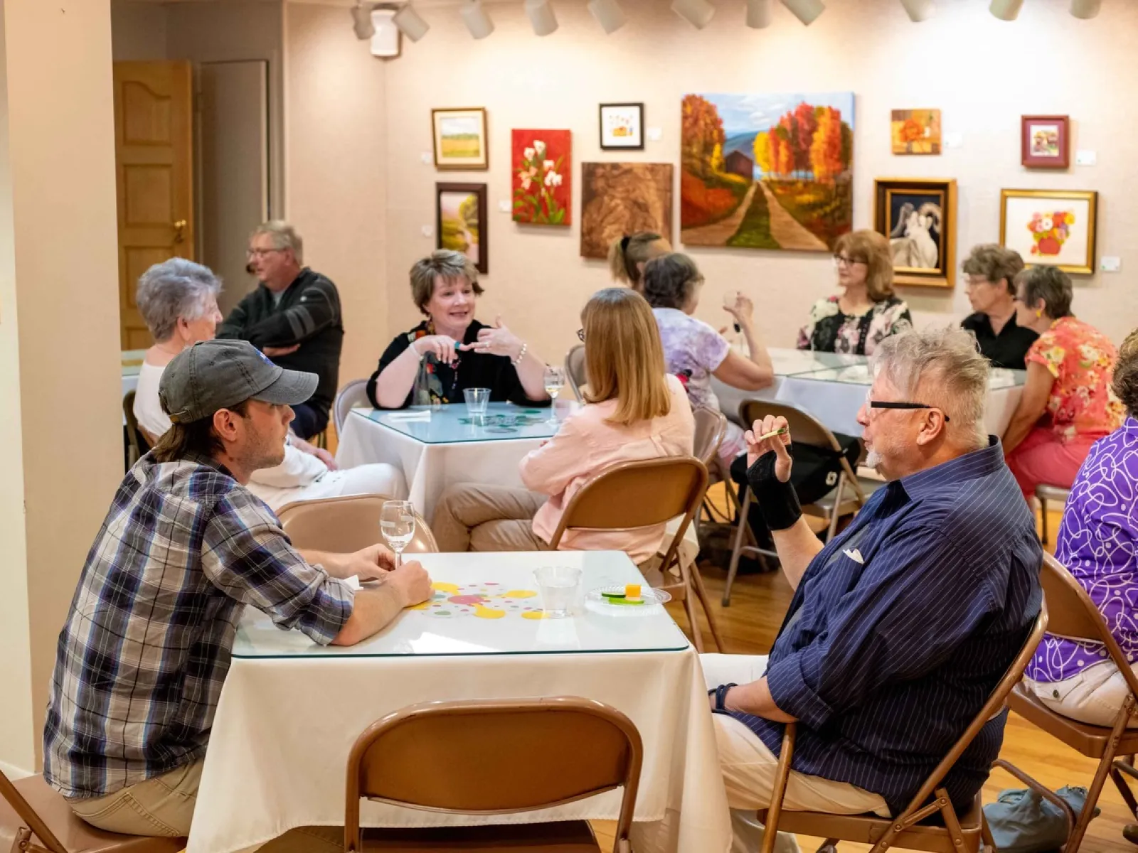 a group of people sitting at tables