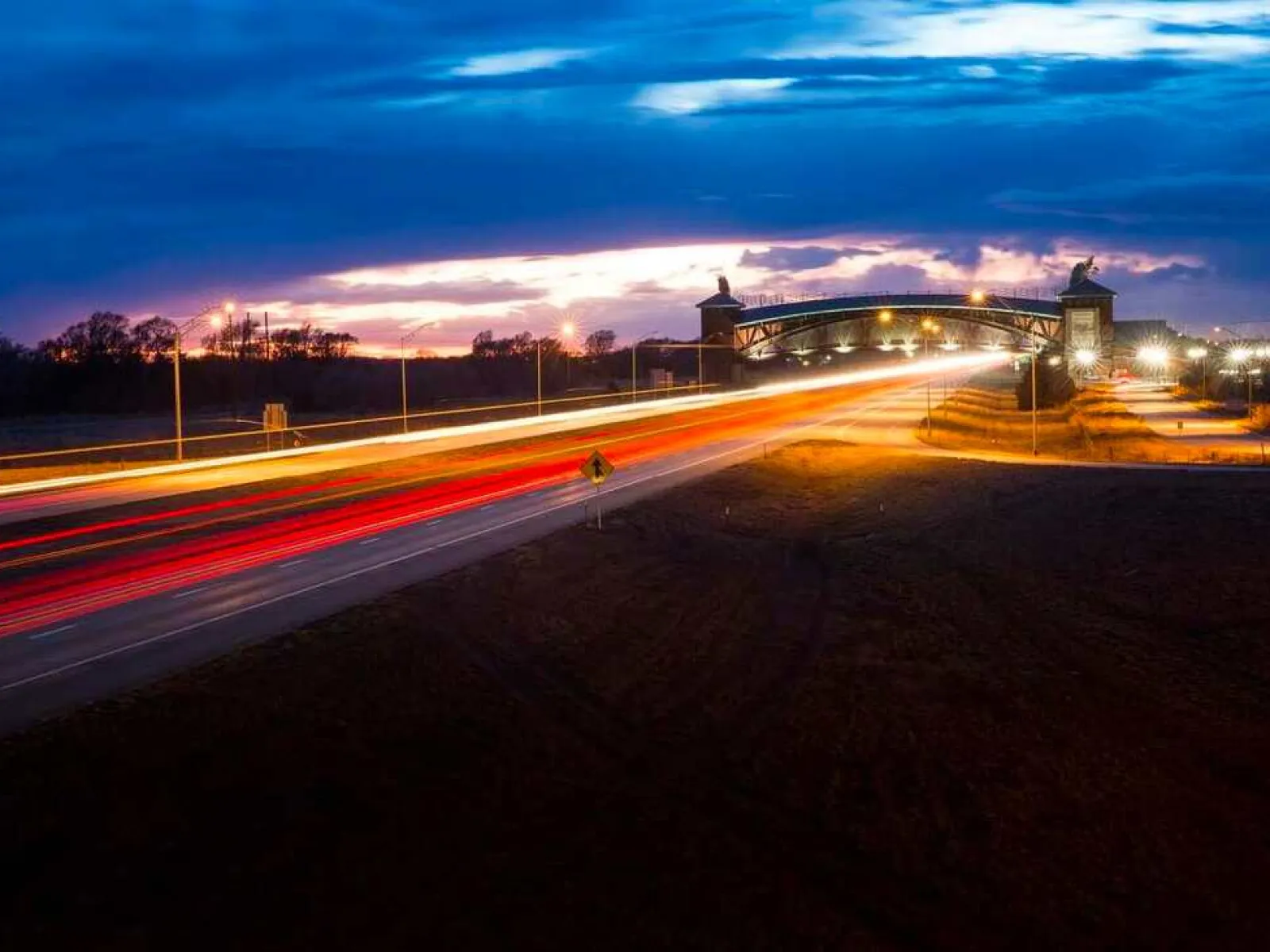 a road with a building in the background