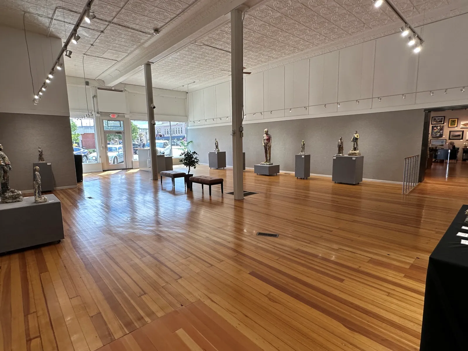a large room with a wood floor and a wood floor