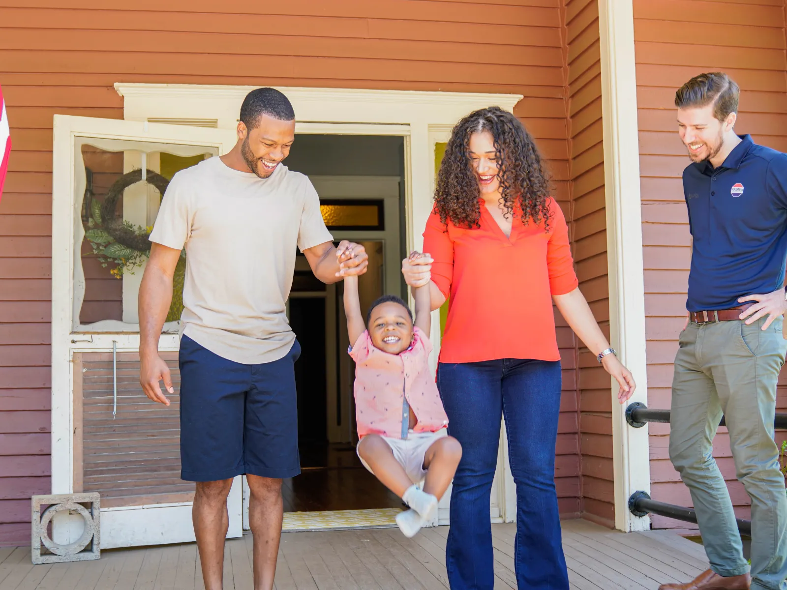 a group of people standing outside a house