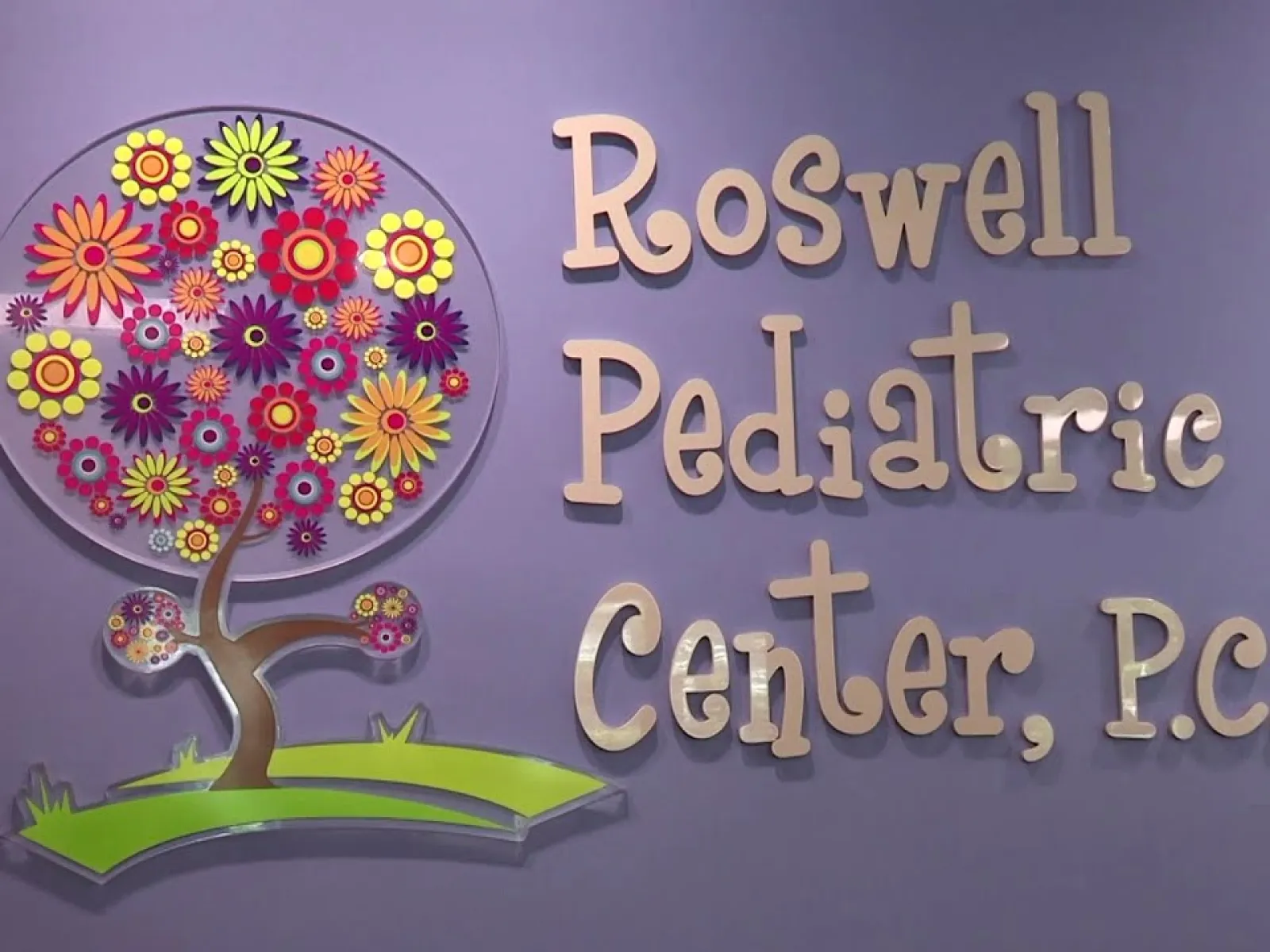 Roswell Pediatric Center on purple wall.