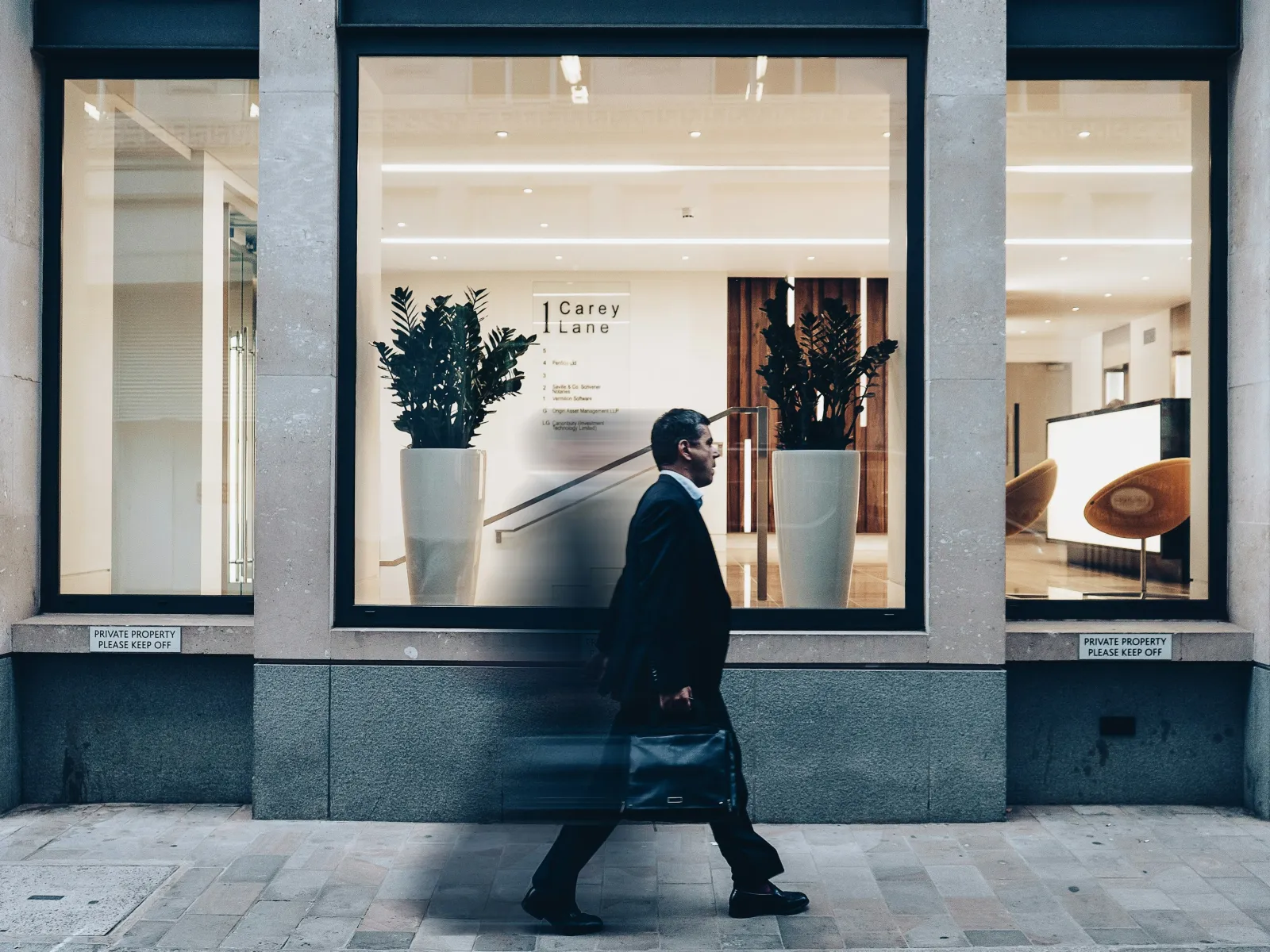 a person walking in front of a building