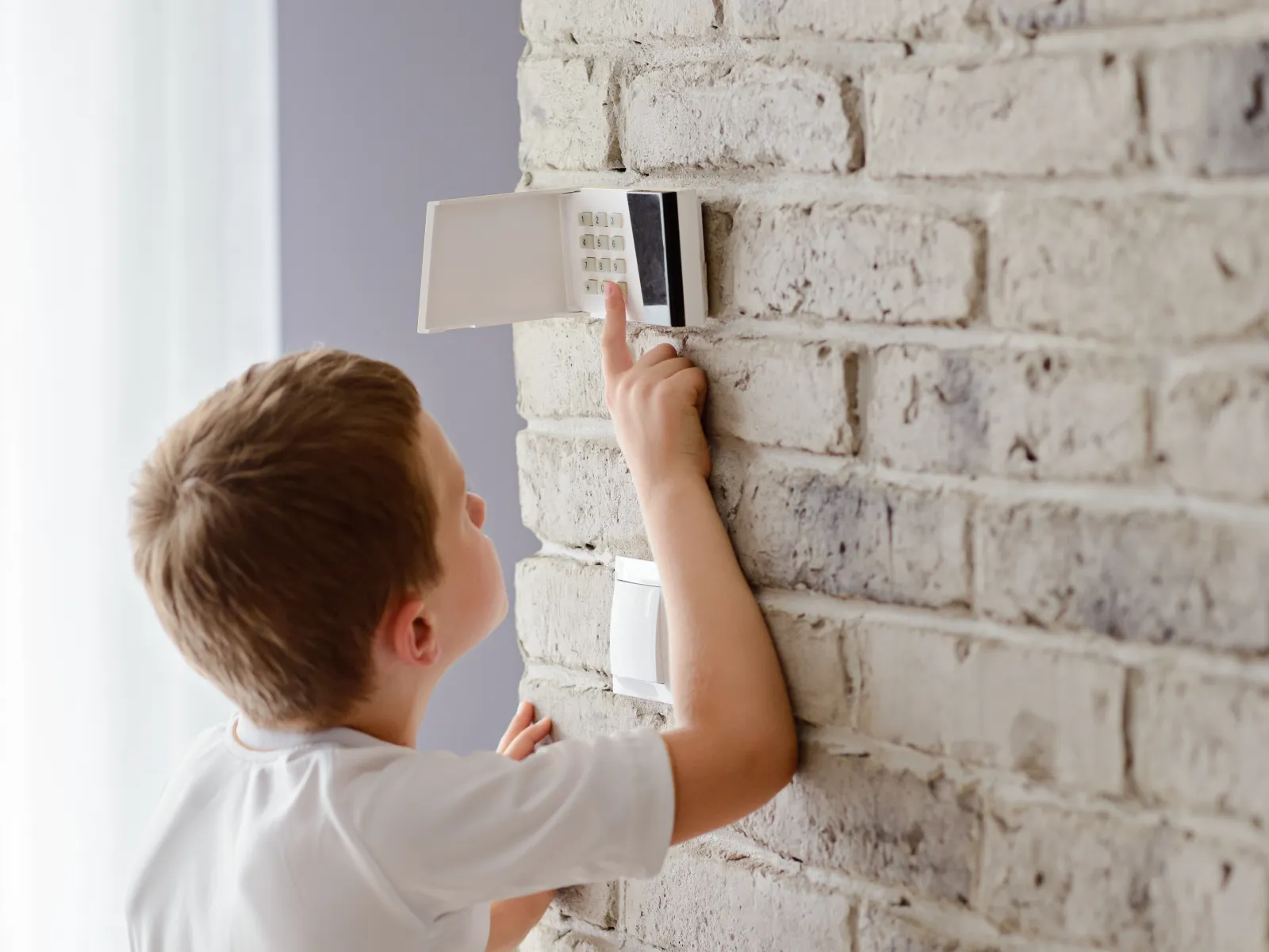 a child touching a panel