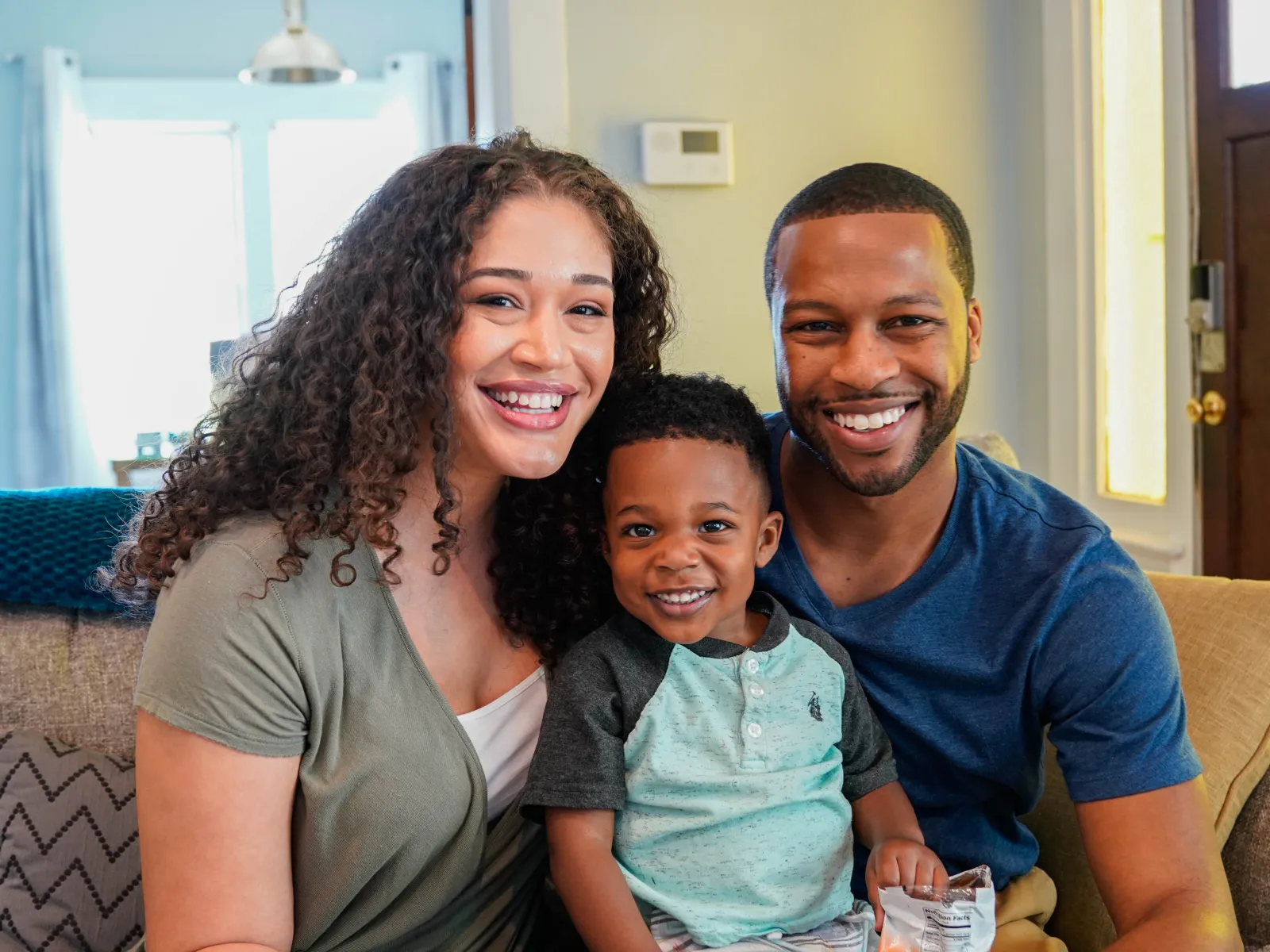 a family smiling for a picture