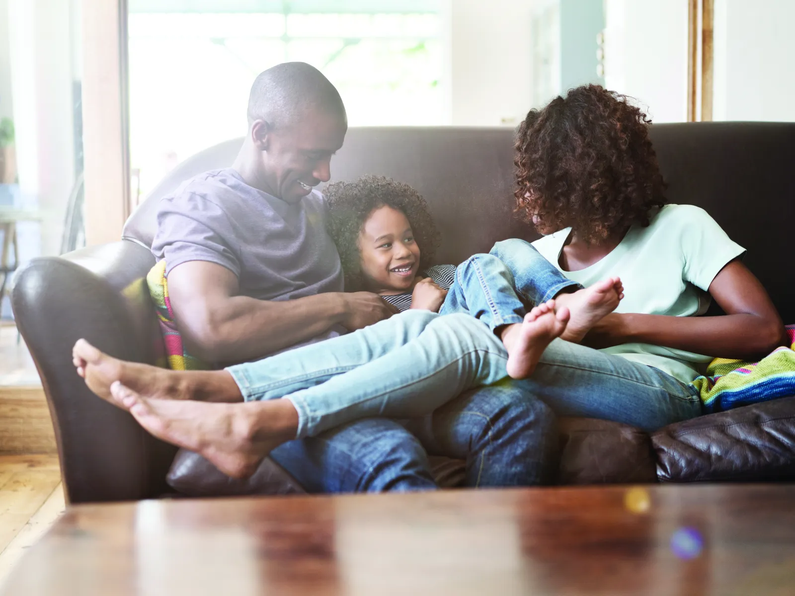 family laughing in living room