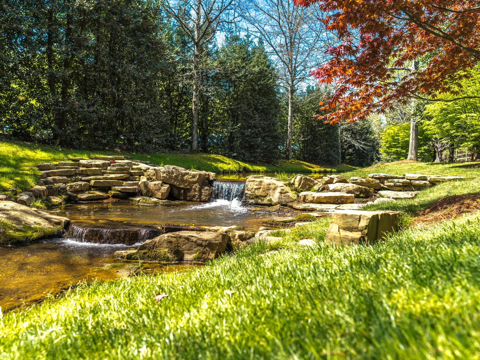 a small waterfall in a park