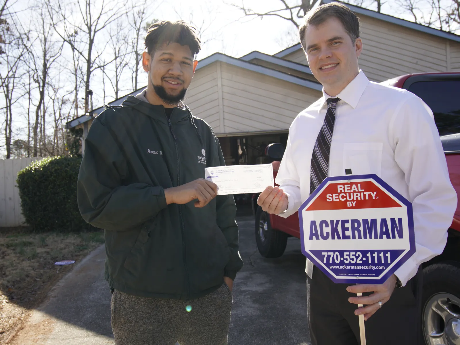 a couple of men holding signs