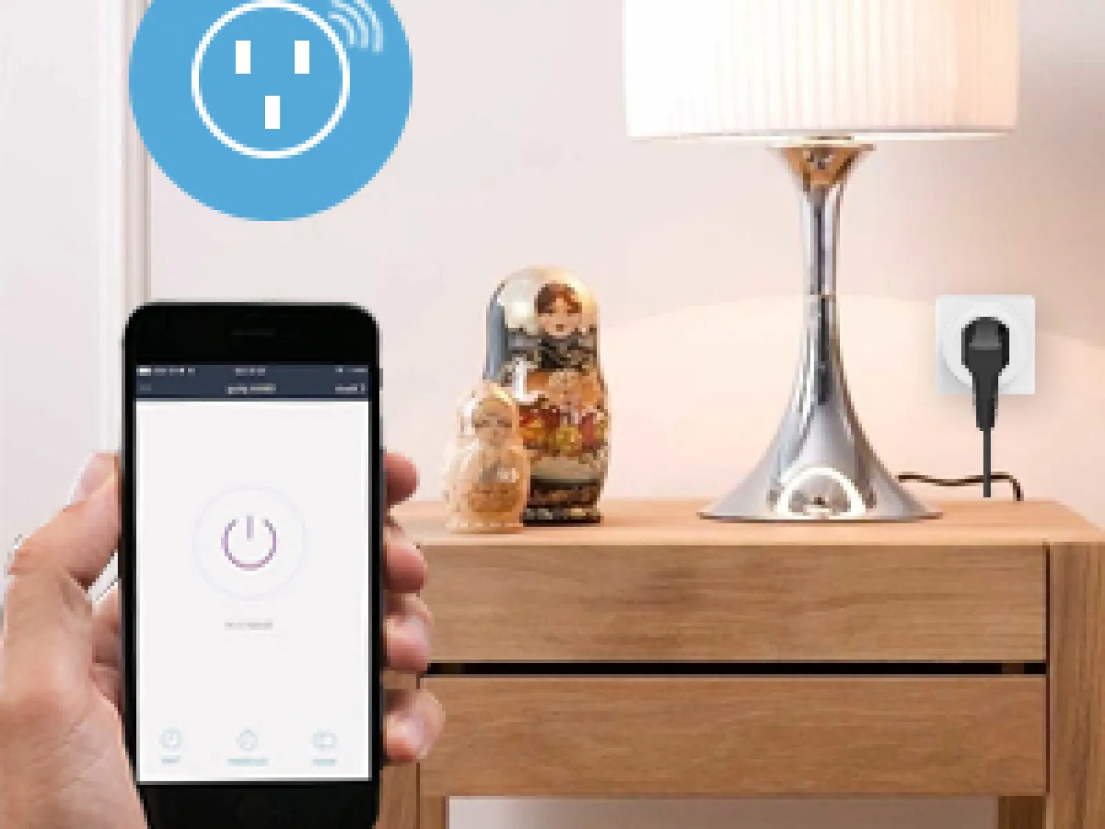 Hand holding smartphone controlling smart plug connected to lamp on wooden side table with decorative dolls.
