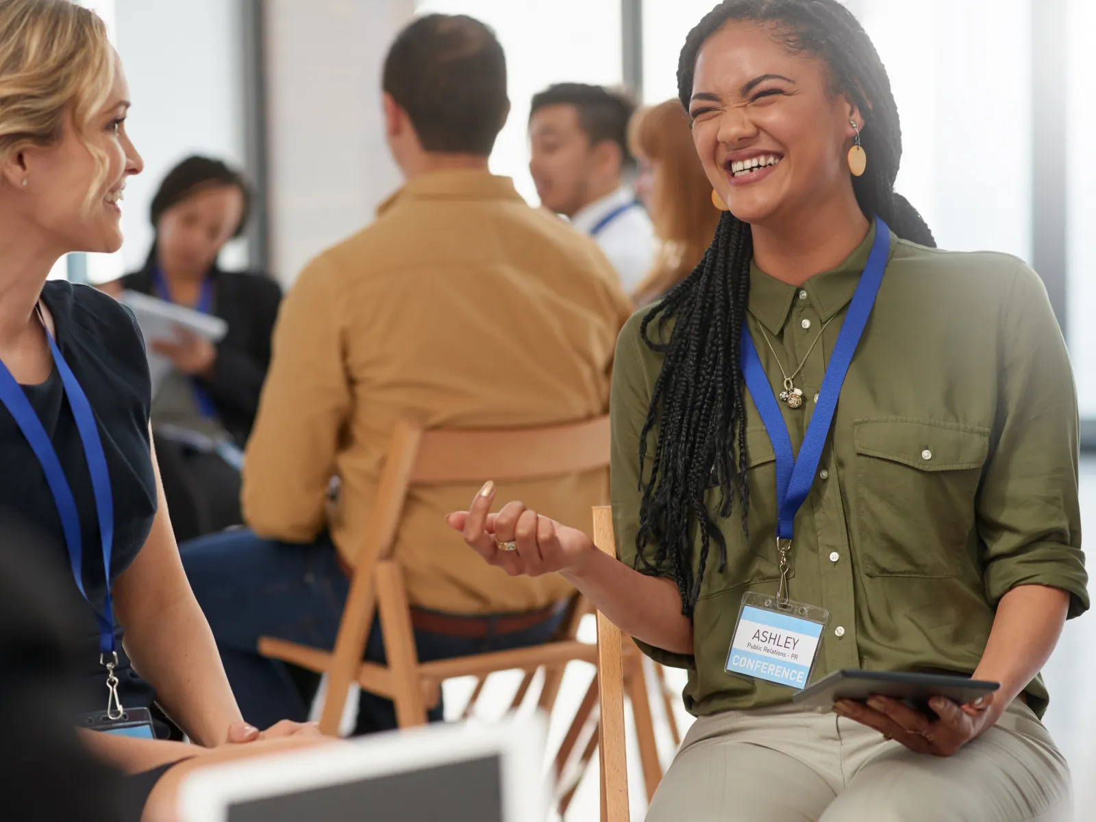 a woman talking to a group of people
