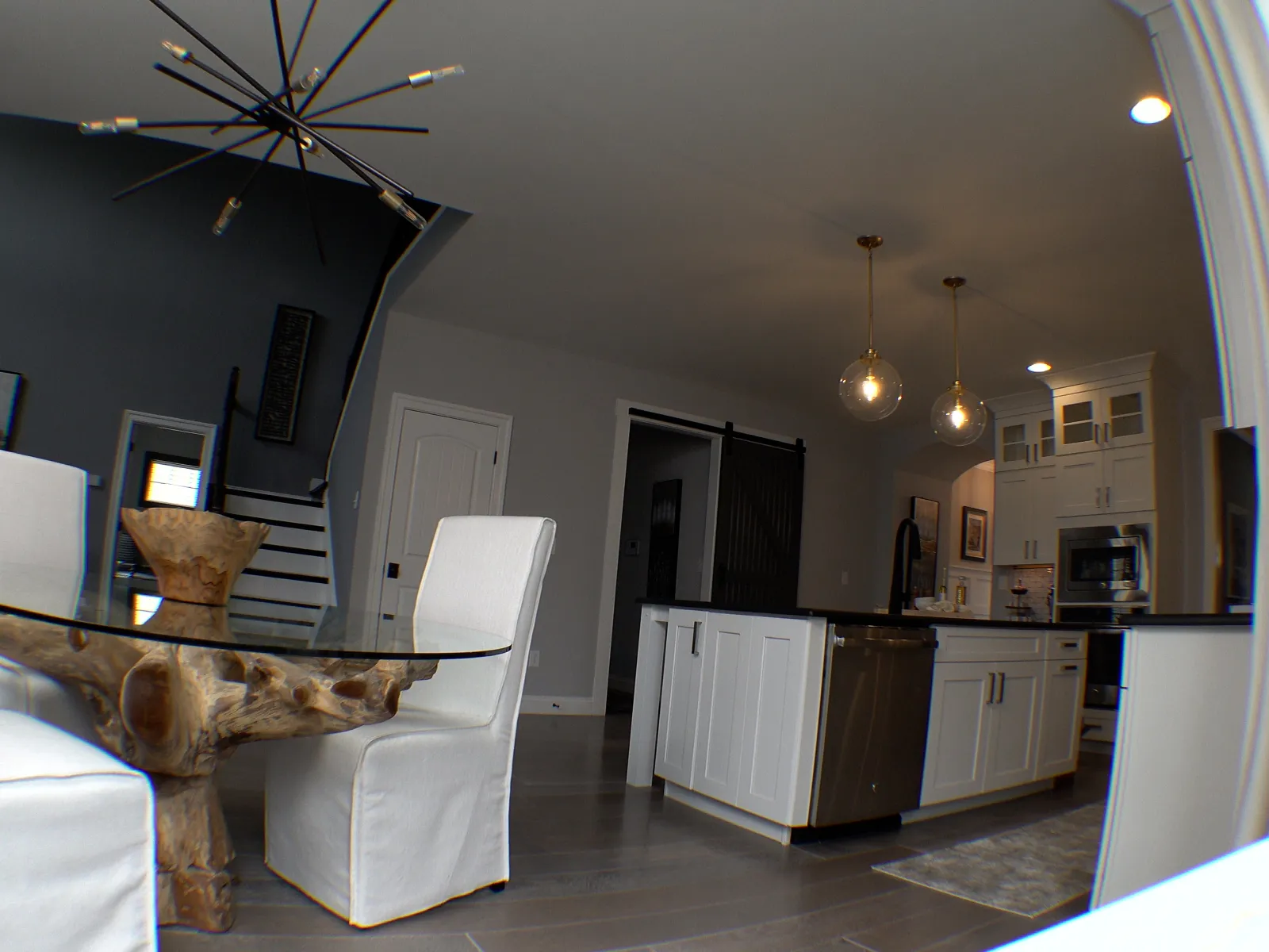 a living room with a couch and chairs