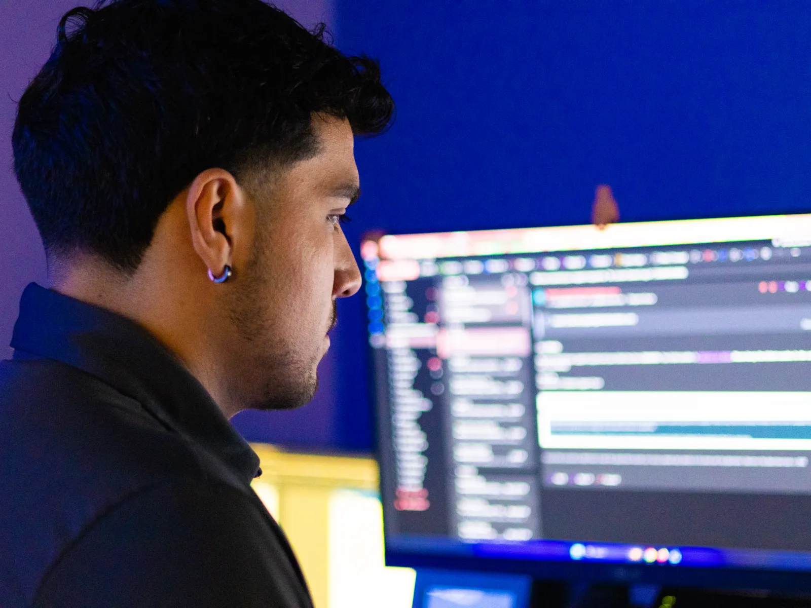 a man looking at a computer screen