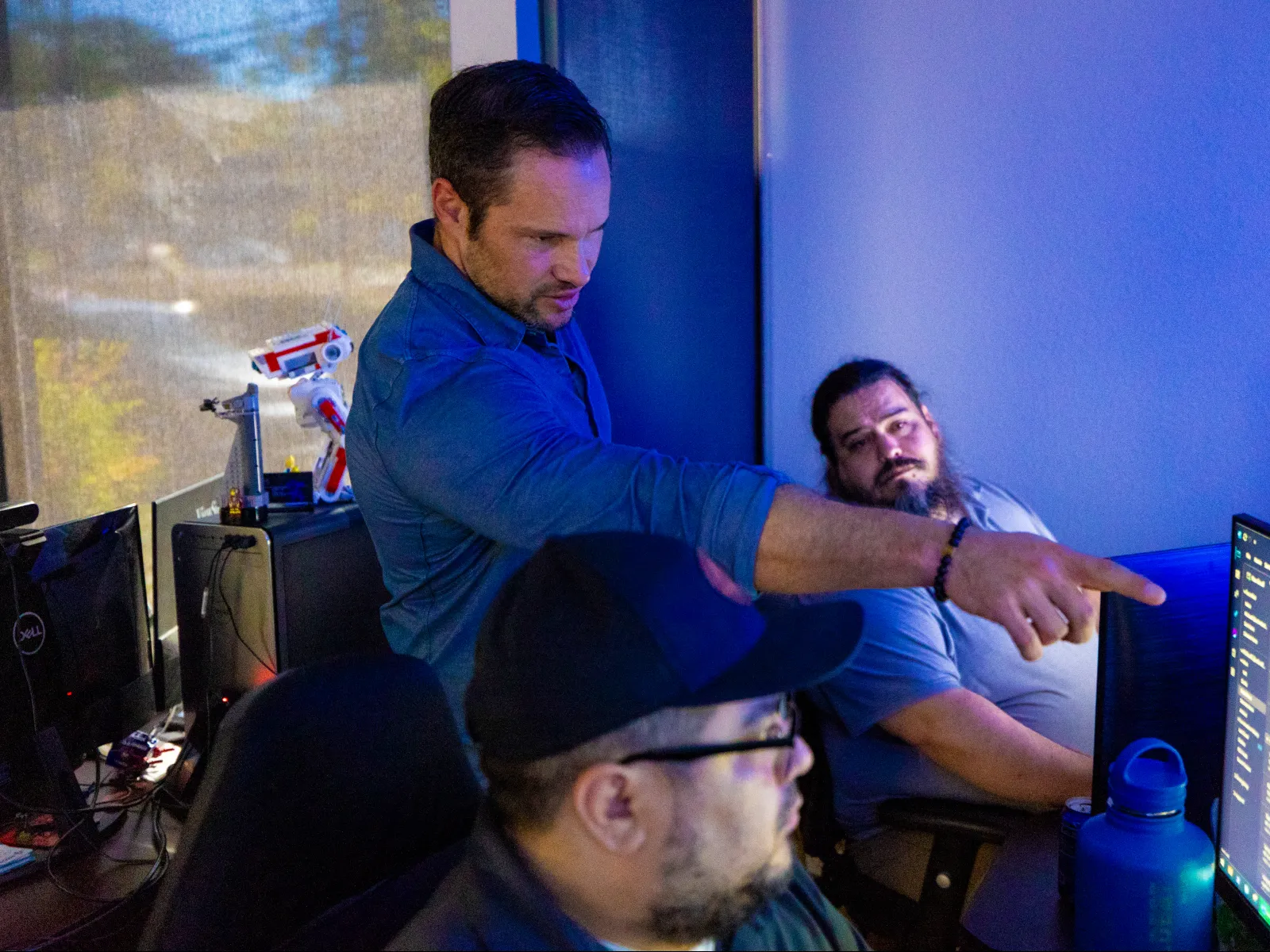 a man pointing at another man