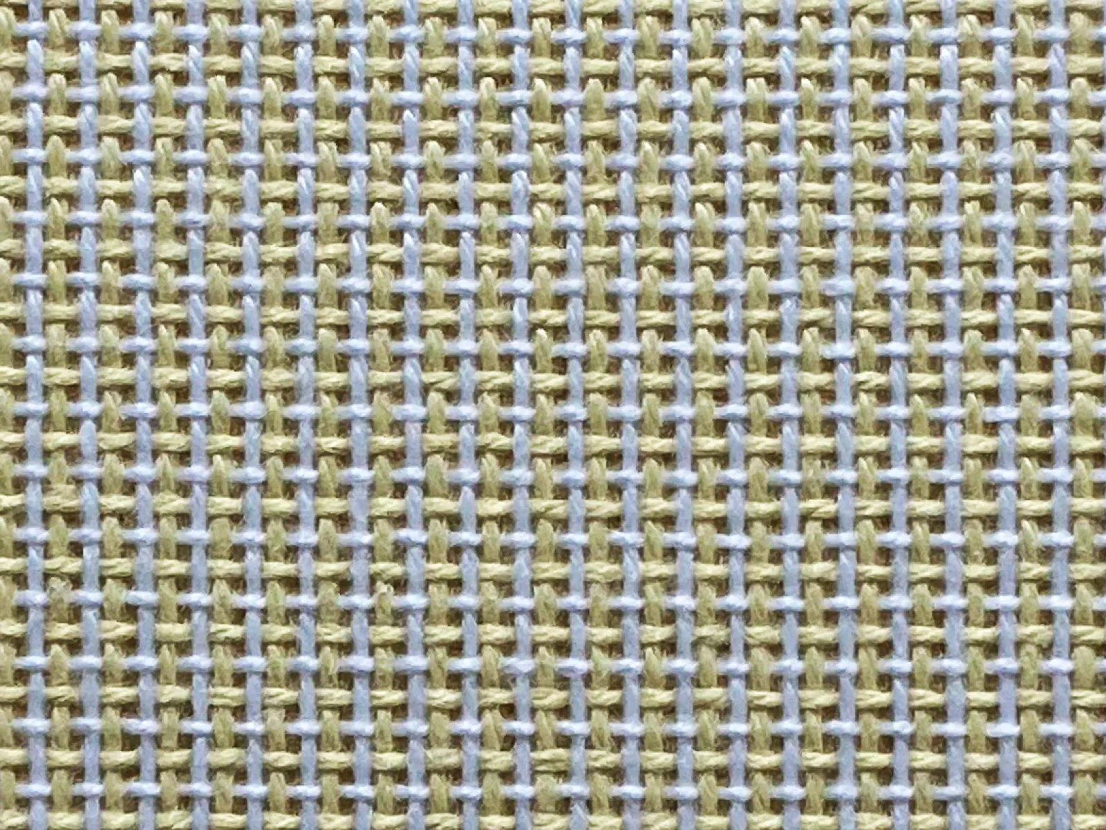 Close-up of beige and light blue woven fabric showing detailed textile pattern and texture
