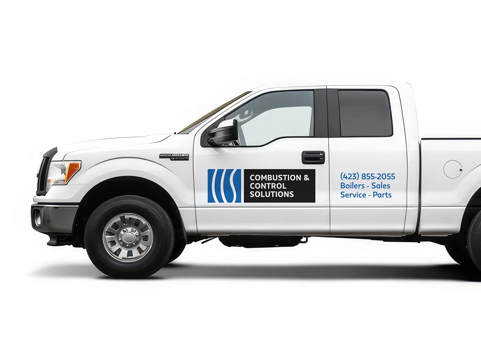 White pickup truck with Combustion & Control Solutions logo and contact info on driver door against white background