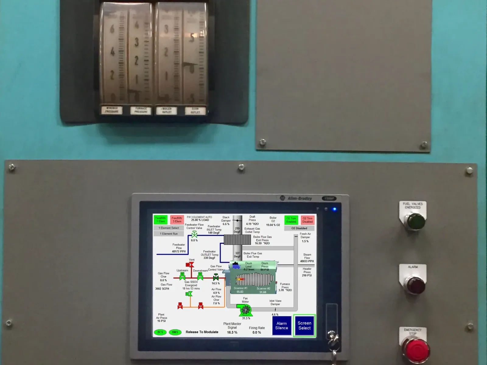Industrial control panel with gauges, flow meters, and digital display showing process data and system status