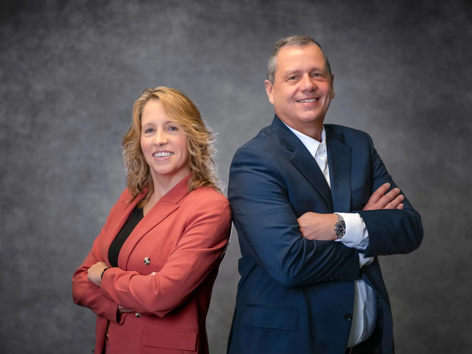 a man and a woman smiling
