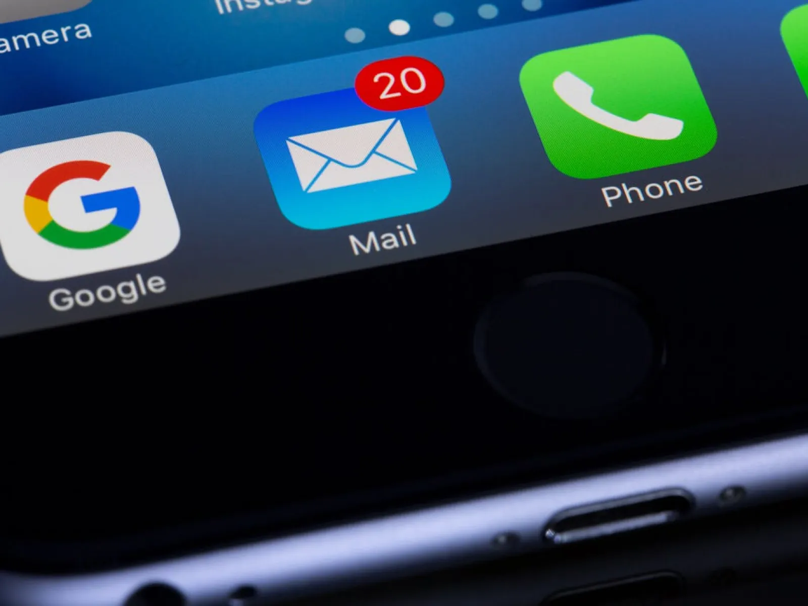 Smartphone screen showing a Mail app icon with 20 unread messages and Google, Phone, WhatsApp icons.