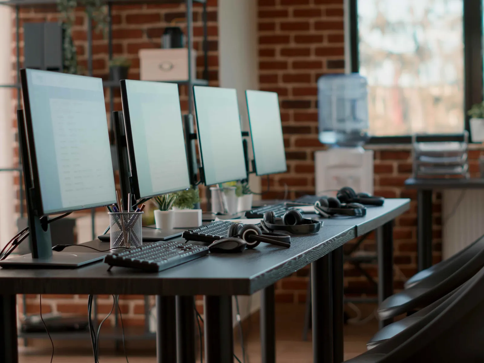 a desk with a computer and other objects on it