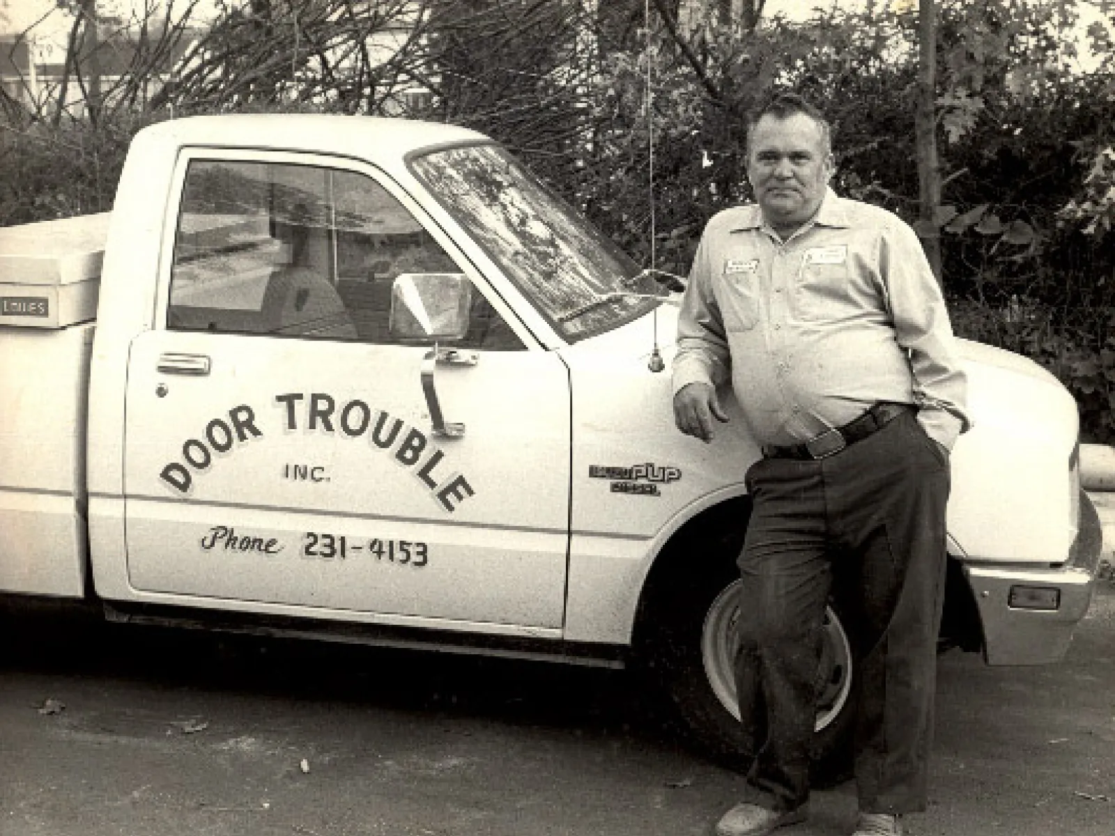 a man standing next to a car
