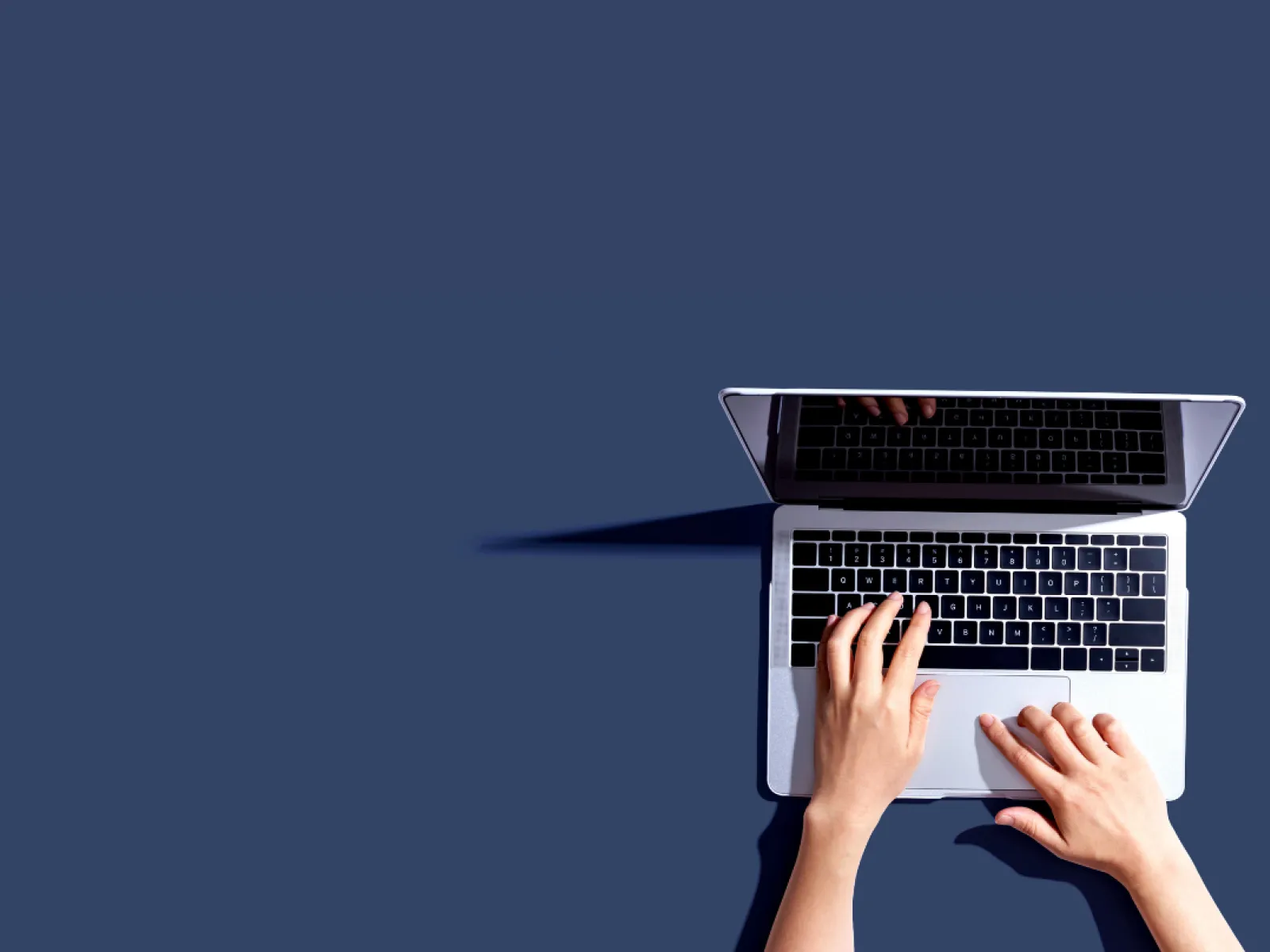 a person holding a laptop