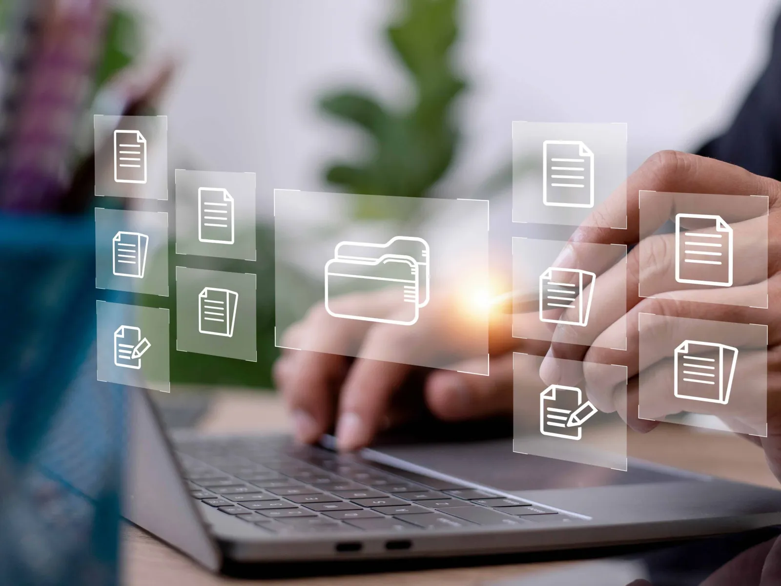 a person holding a laptop