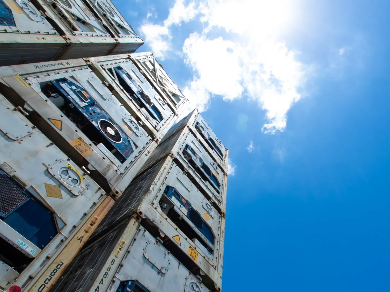 a group of buildings with a blue sky