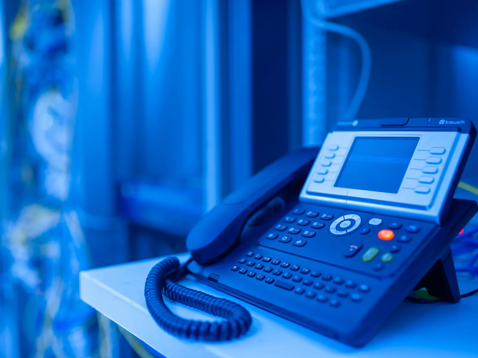 a telephone on a blue table