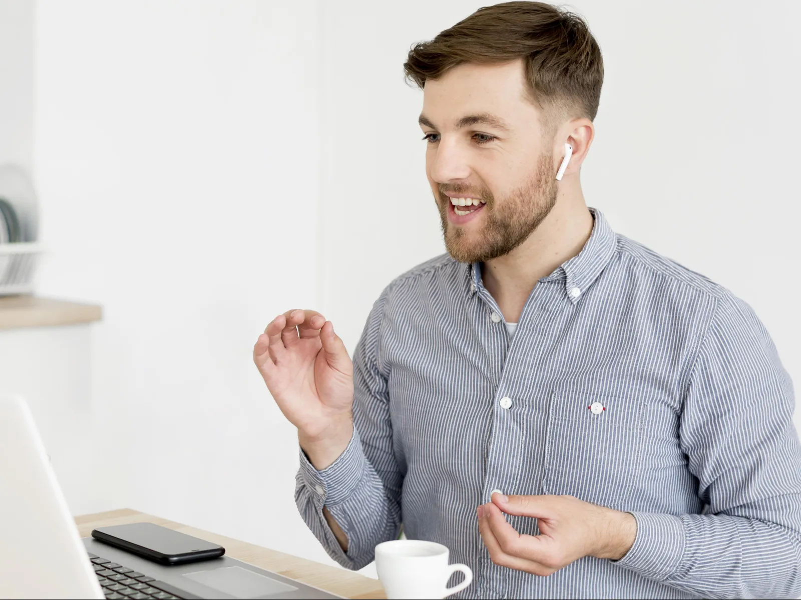 a man holding a cup