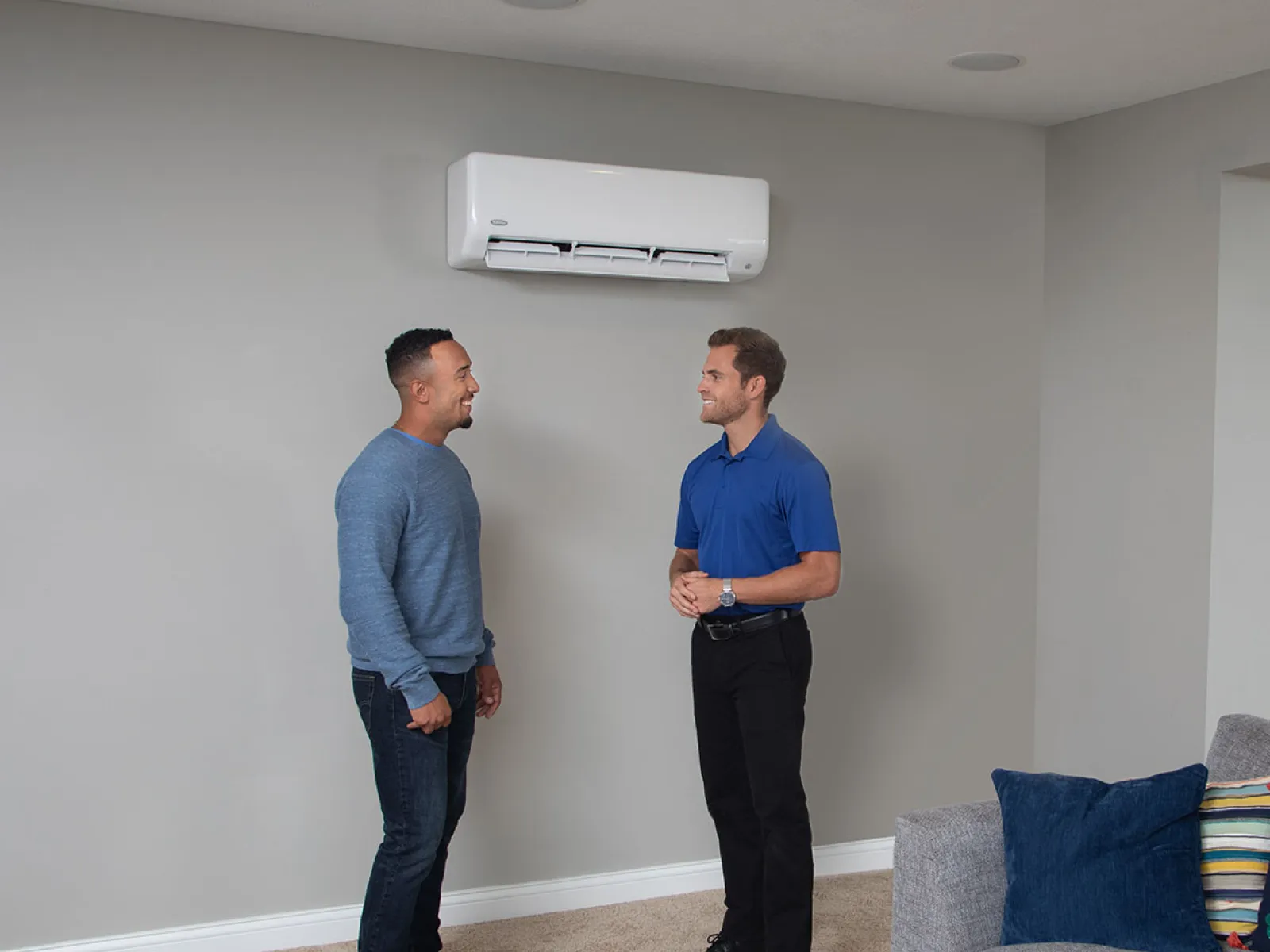 a couple of men standing in a room