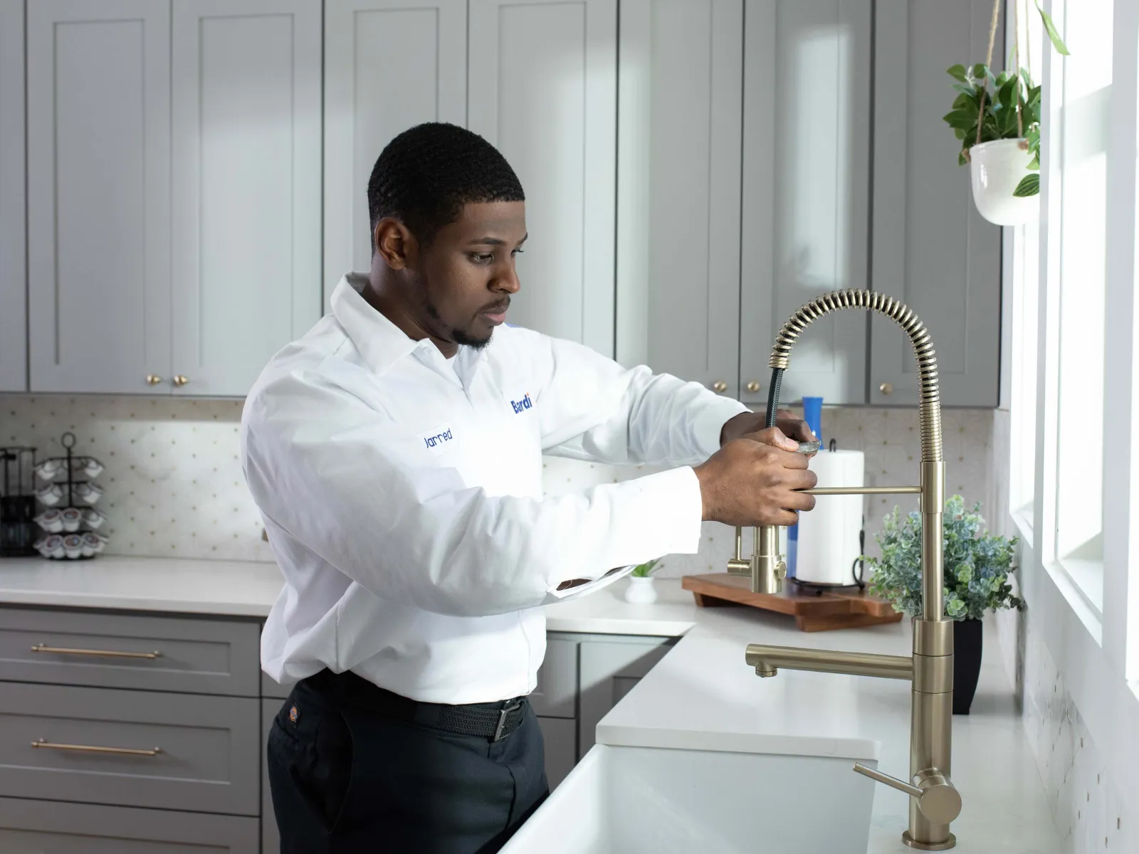 a person pouring a liquid into a glass