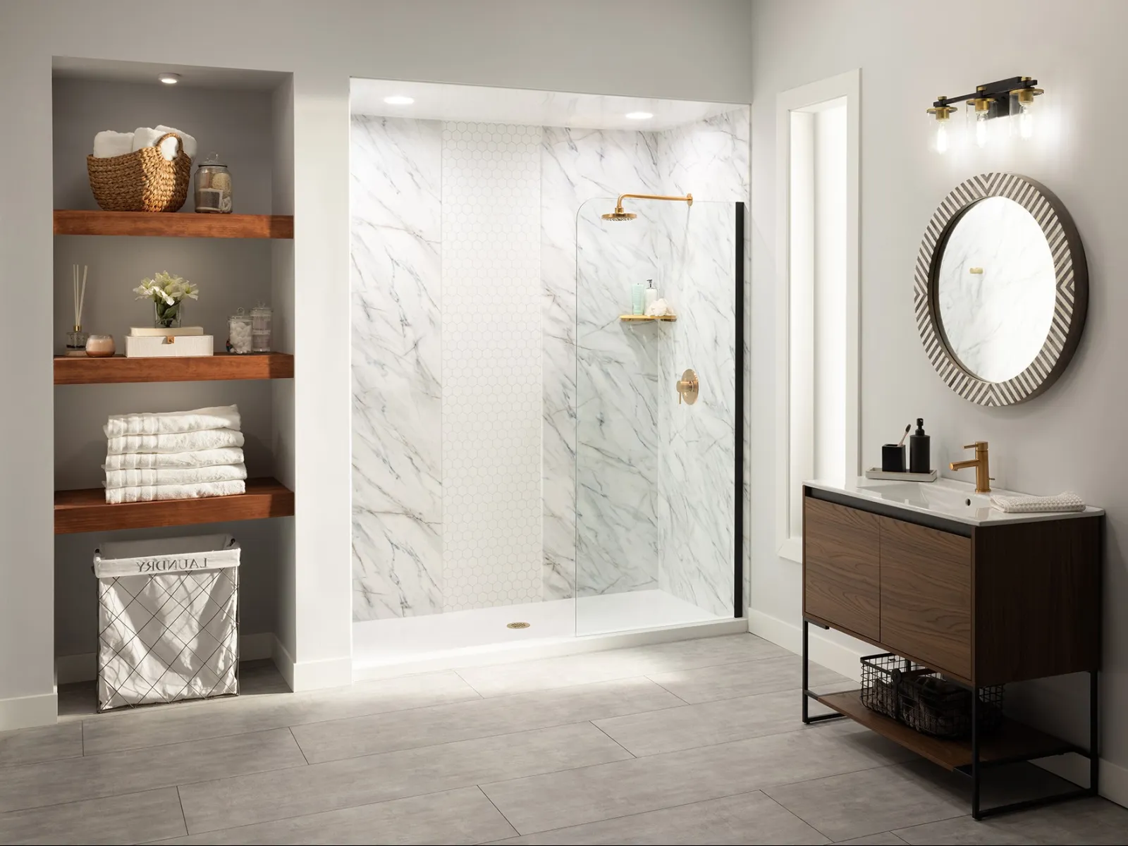 a bathroom with a glass partition and a vanity with a round mirror above