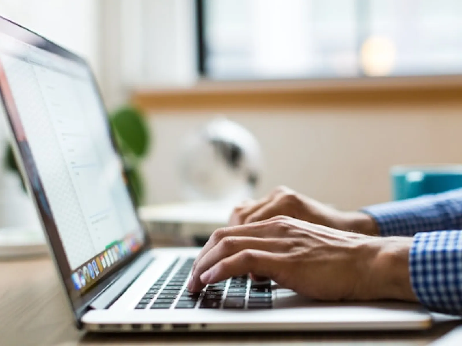 a person typing on a laptop