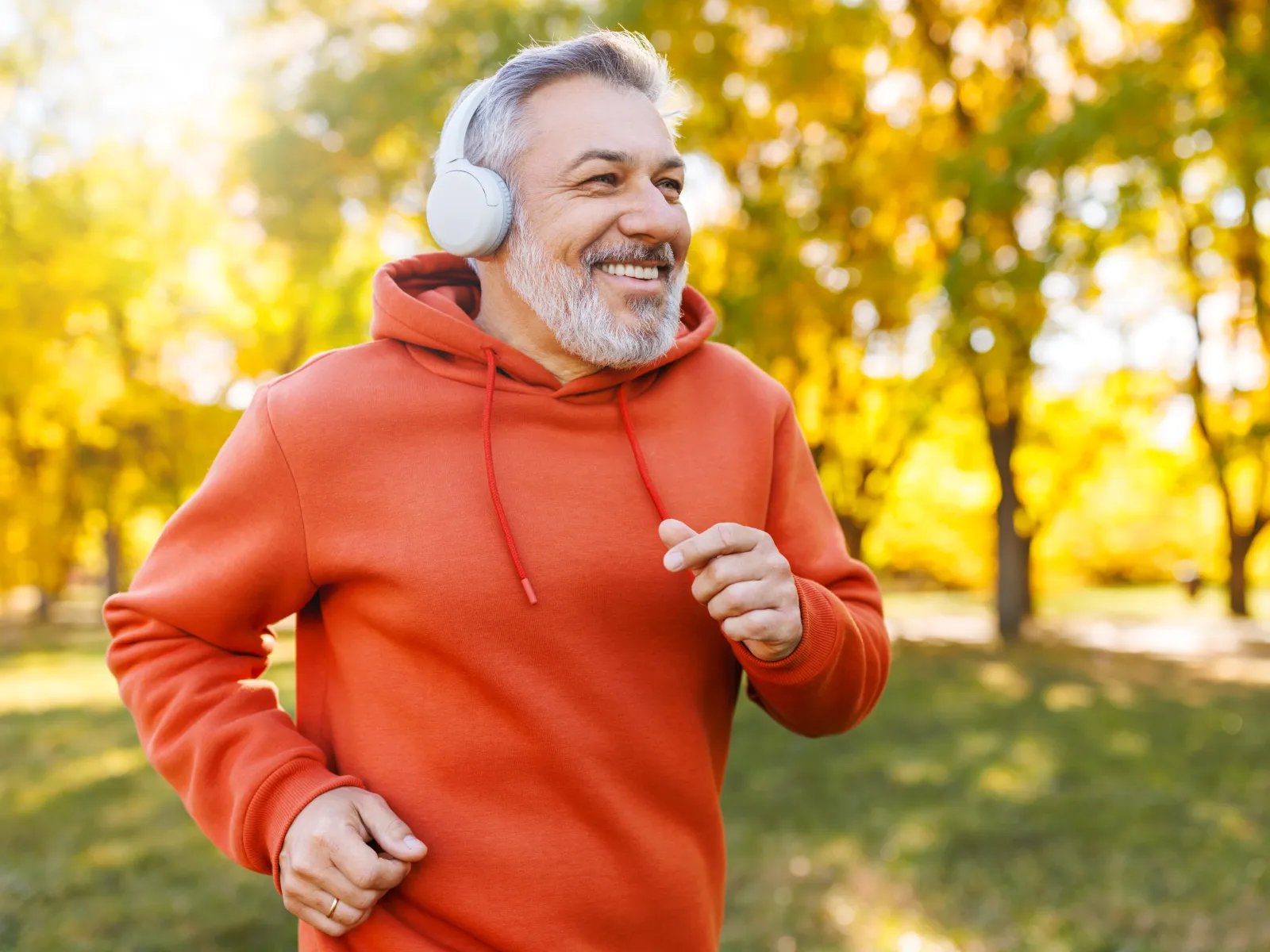 a man running while wearing headphones