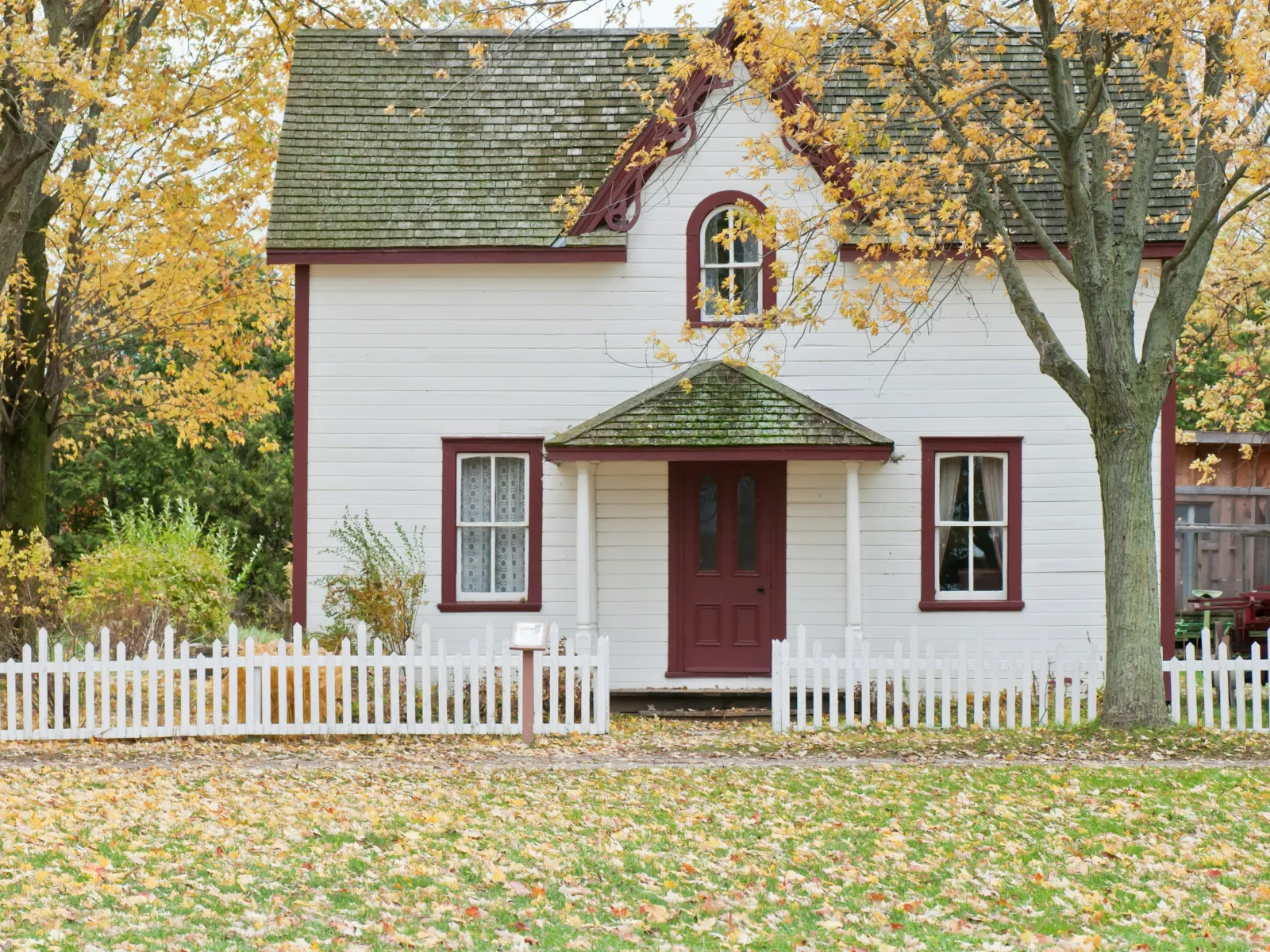 a white house with a red door